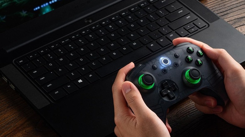 8BitDo Controller wirelessly connected to a laptop playing a game