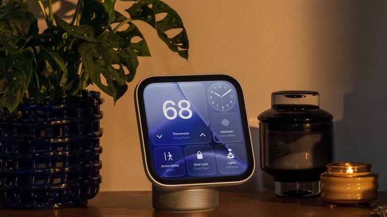 Apple's HomeView on a desk with a plant and a candle