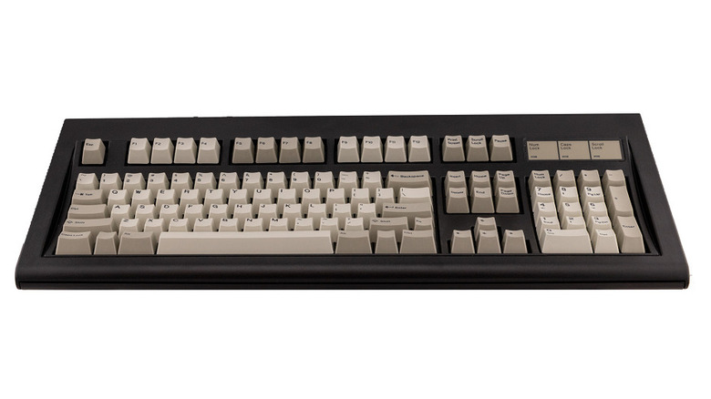 A Classic Style F104 Model F keyboard with a black body against a white background