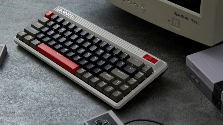 The Durgod K230 Fusion Steam keyboard in front of a CRT monitor