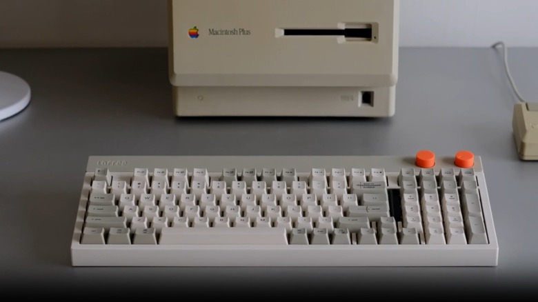 The Lofree Block mechanical keyboard in front of an old Macintosh Plus computer