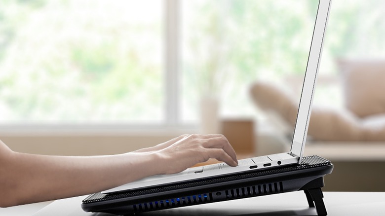 Laptop mounted on to a cooling pad