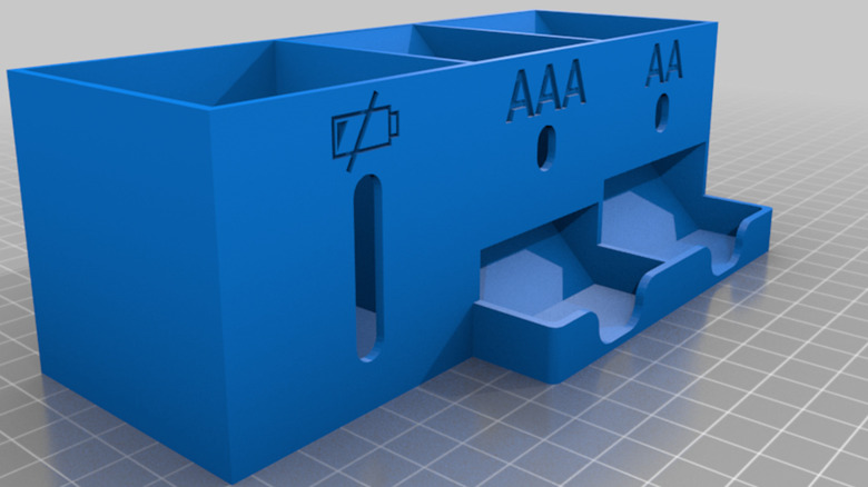 A 3D render of a battery organizer, with a section for AA, AAA, and dead batteries.