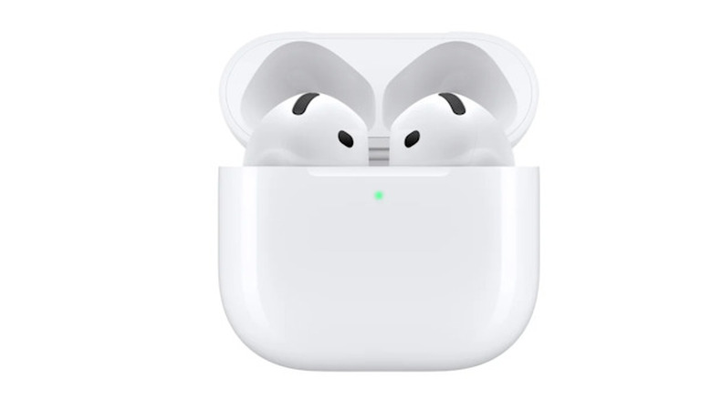 Apple AirPods 4 inside their charging station