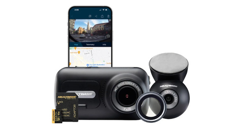 Nextbase dash camera and rear-view camera lined up in front of a smartphone