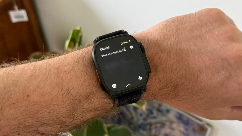 A man's wrist with an Apple Watch Ultra on