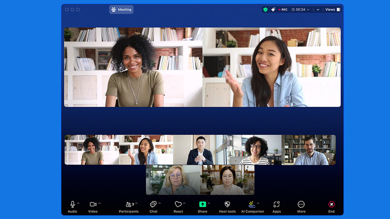 Zoom video calling app showing multiple speakers and video recording options.