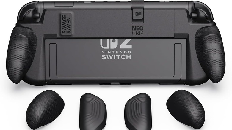 Rear view of a Nintendo Switch console fitted with a black ergonomic grip accessory, with multiple interchangeable grip attachments displayed below, all on a white background.