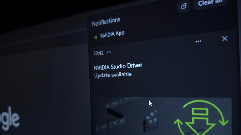 A close-up of a monitor showing the Nvidia app with the notification of an available driver update