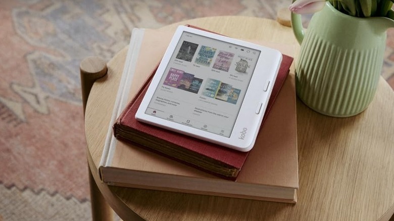 Kobo Libra eReader on top of books on a nightstand