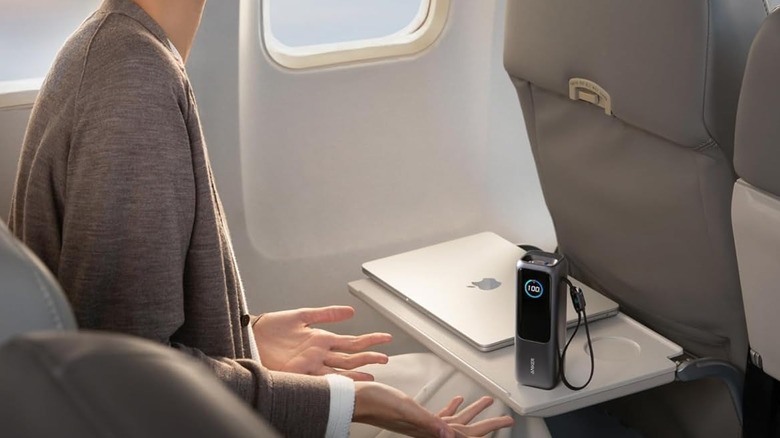 Anker power bank sitting on an inflight tray