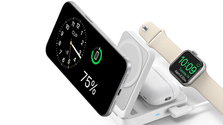 An iPhone, an Apple Watch, and AirPods connected to the Anker MagGo Wireless Charging Station