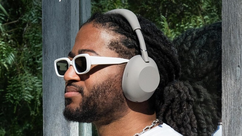 A person wearing the Sony WH-1000XM6 headphones