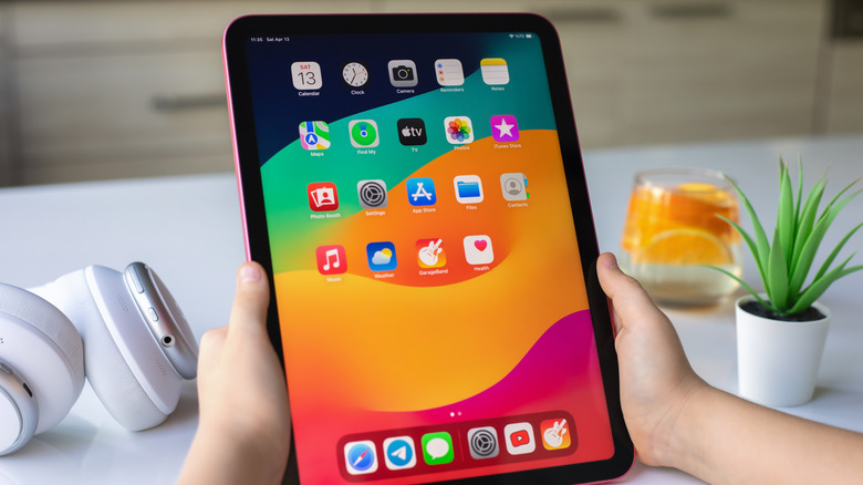 Person holding unlocked iPad