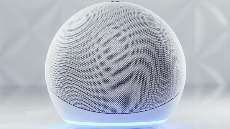 The Amazon Echo 4 on a white background with a neon blue light under it