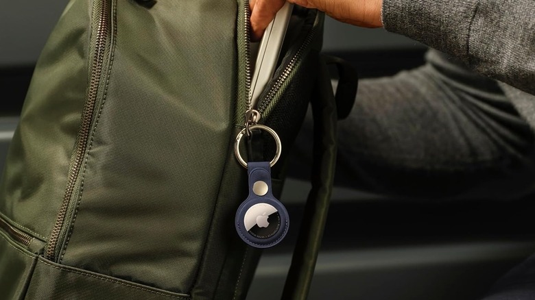 The Apple AirTag 2 item tracker attached to a backpack's zipper.