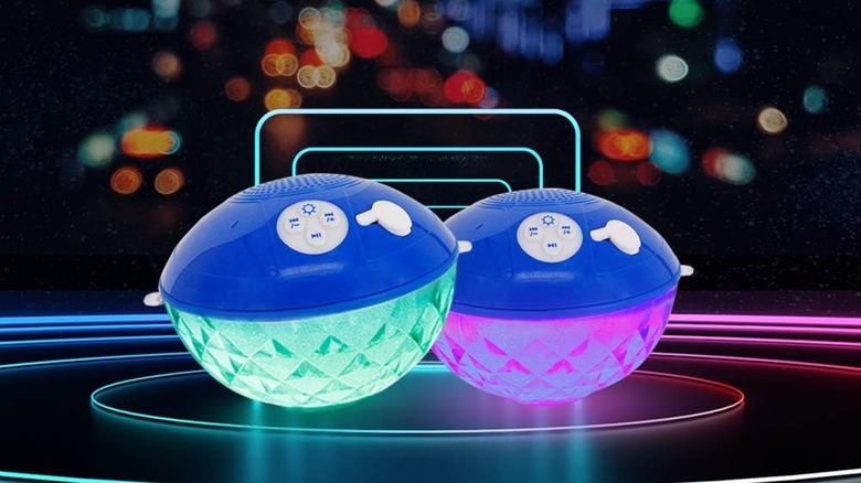 A pair of Blufree BT601 floating Bluetooth speakers with their lights turned on.