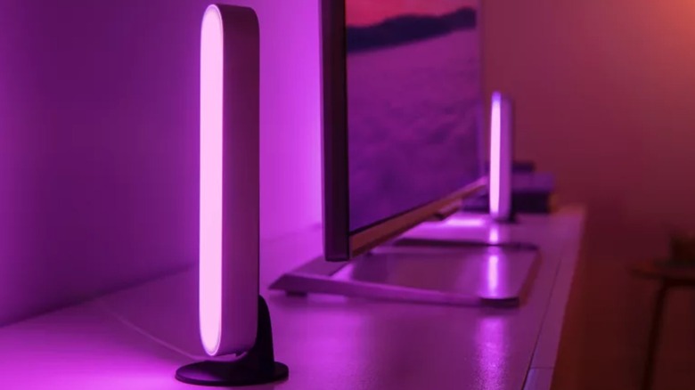 The Philips Hue Play Light Bar smart lights placed at either side of a TV.