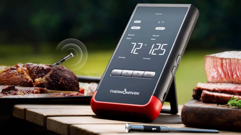 The ThermoMaven WT02 wireless meat thermometer used on grilled meat.