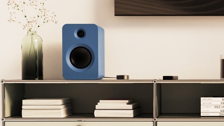A Kanto Audio speaker on a shelf