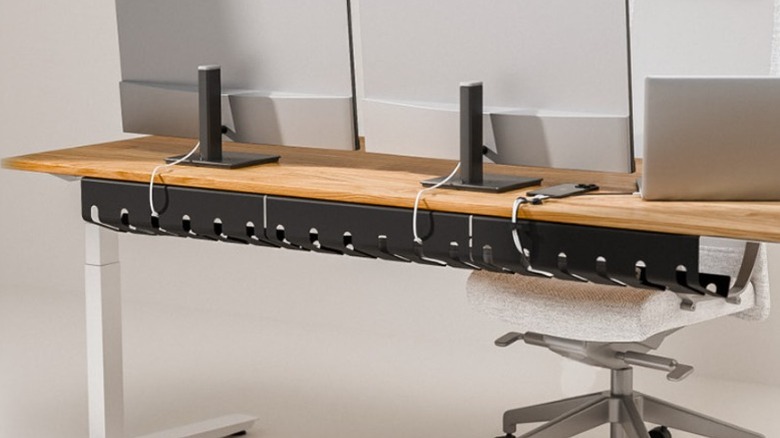 The Pamo Cable Management Tray attached to the underside of the desk.