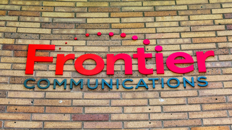 Frontier communications logo on building wall