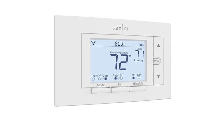 Sensi Smart Thermostat on a white wall with a fully lit display