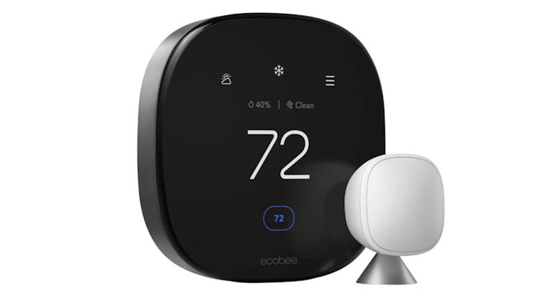 Ecobee Thermostat next to its smart sensor.