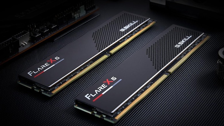 Two RAM disks placed side by side on a black surface.