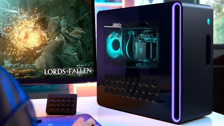 Lords of the Fallen game on a monitor placed beside Alienware PC.