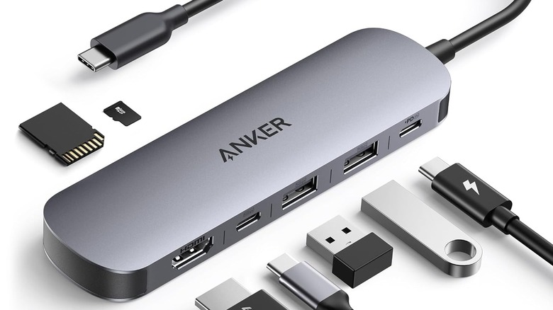 A render of the the Anker USB-C 7-in-1 multport hub and the various types of cable that might plug into it