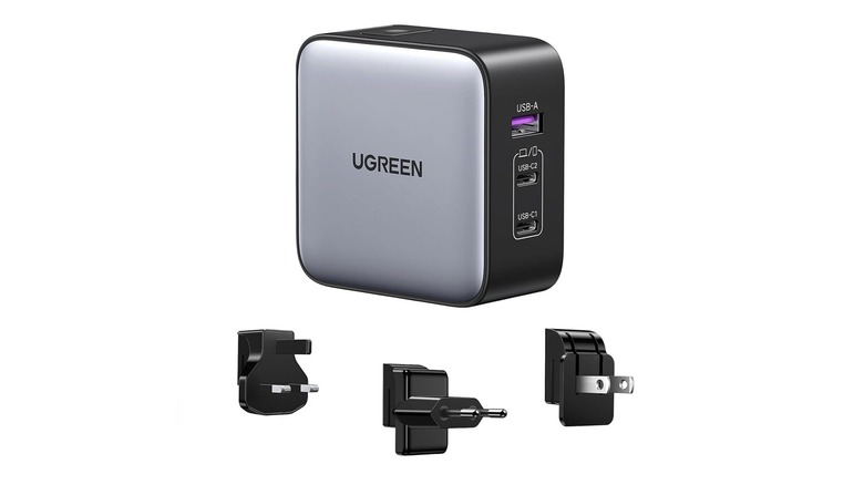The Ugreen 65W USB-C international charger with its three adapters on a white background.