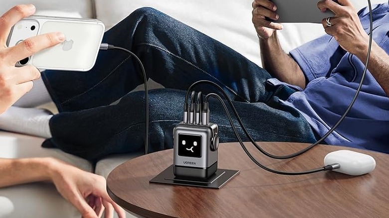The Ugreen Uno 100W robot charger charging four devices at once.