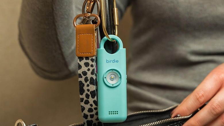 The She's Birdie 3.0 personal safety alarm, used as a keychain.