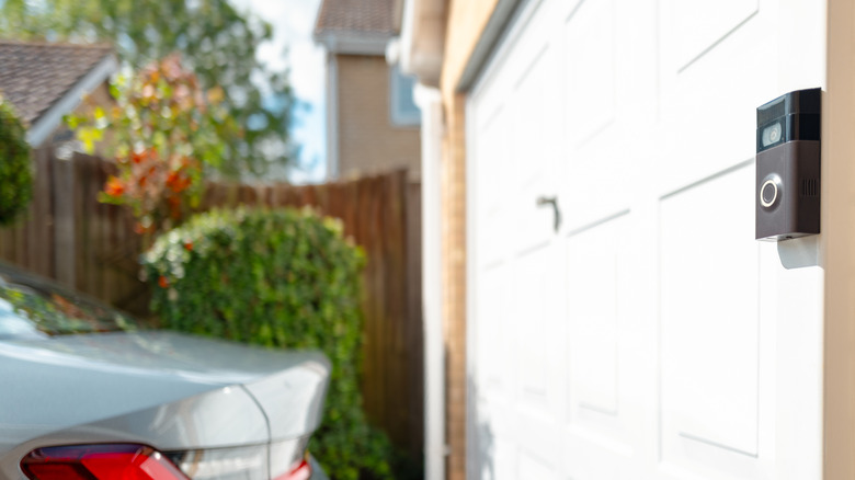 a Ring camera mounted on a wall, observing outside