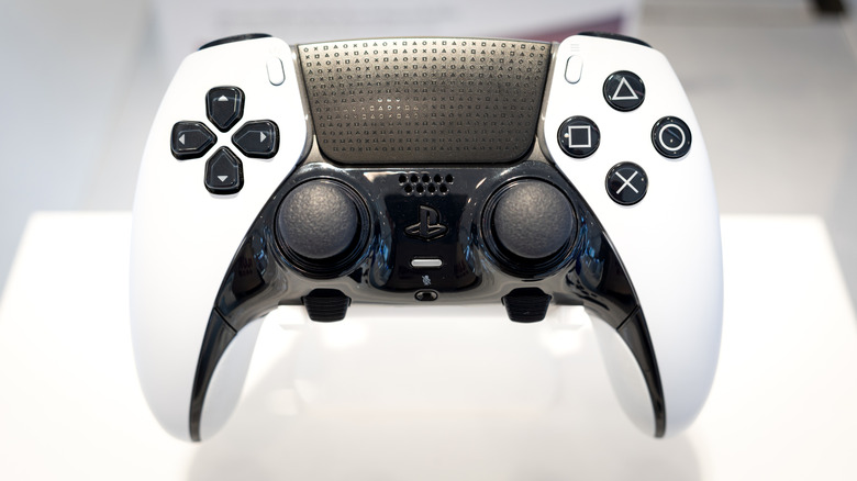 Sony PlayStation DualSense Edge controller on a display stand with clean white background