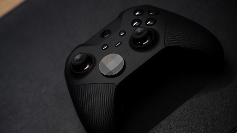 Top down view of Xbox Elite Series 2 black controller on a dark grey desk mat