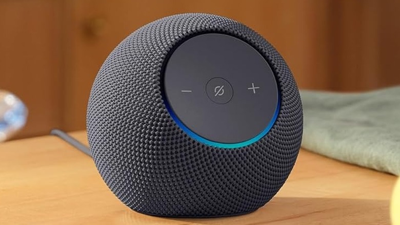 The Amazon Echo Dot Max smart speaker on a wooden table.