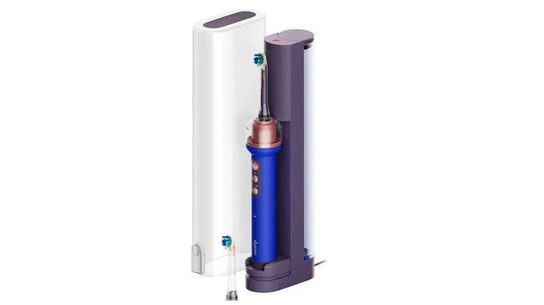 The Dyson CameraJet electric toothbrush on its charging dock on a white background.