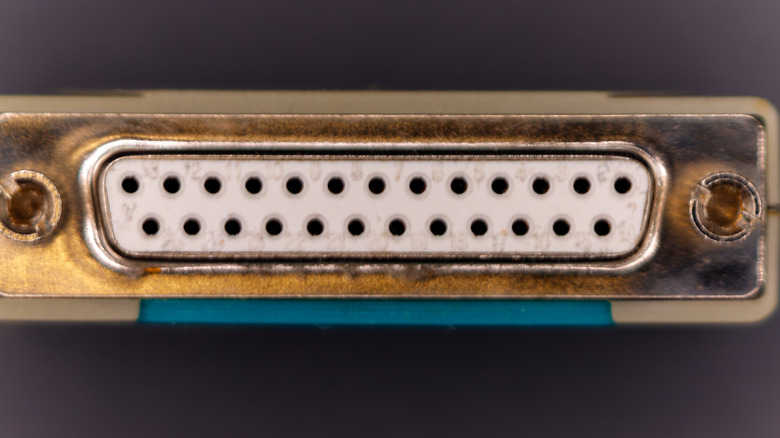 Close view of an old computer port, likely a parallel port.