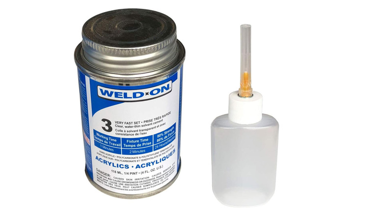 Bottle of Weld-on next to the applicator