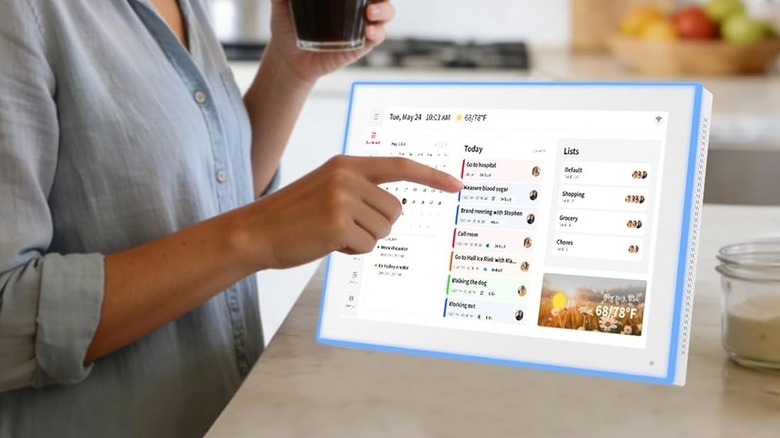 Akimart Digital Calendar wit ha woman pointing at the display
