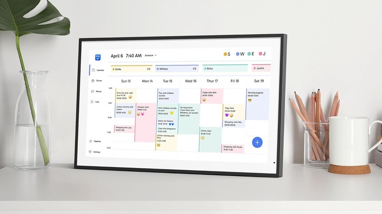 Dragon Touch Digital Calendar next to a cup of a coffee on a counter