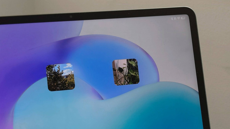 The home screen of an Android tablet, showing two Material Photo Widget widgets.