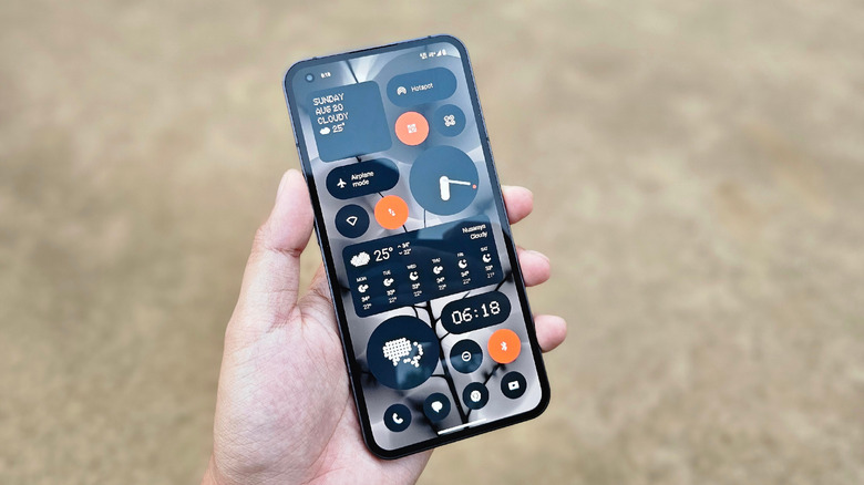 A Nothing Phone (1), with numerous widgets.
