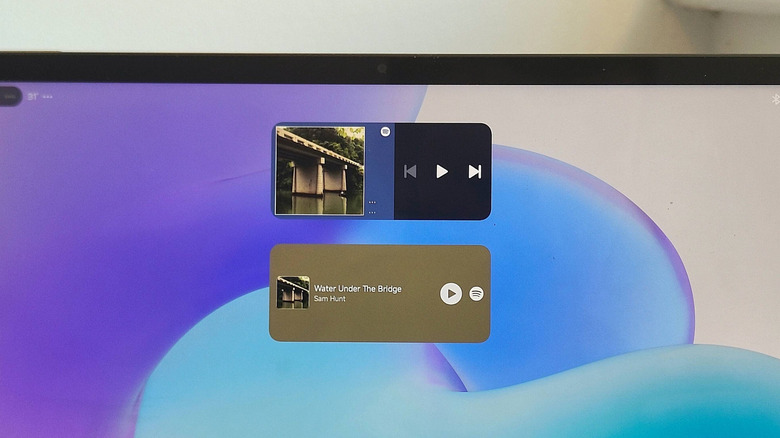 The home screen of an Android tablet, showing two Spotify widgets.