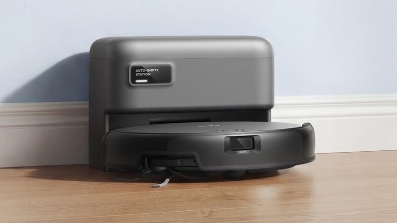 The Eufy C10 robot vacuum docked in its auto-empty station.