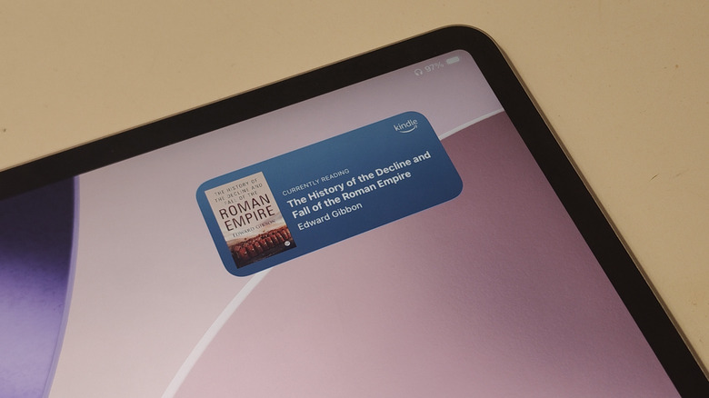 An iPad showing the Kindle's Currently Reading widget.