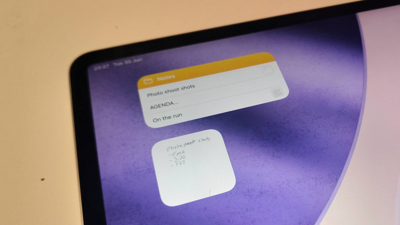 An iPad, with two different Notes widgets on display.