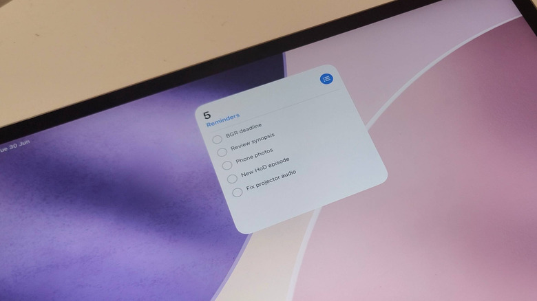 An iPad showing the Reminders widget.